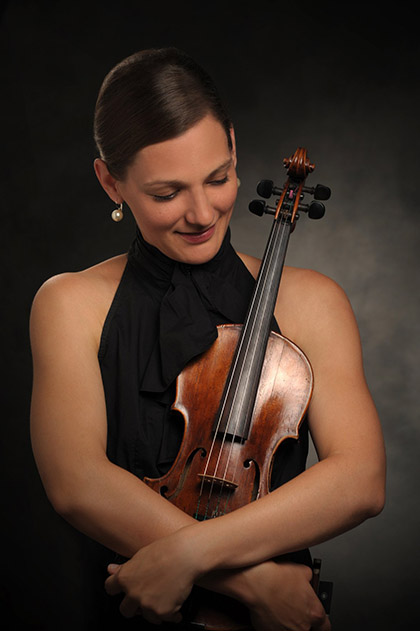 Orsi Szalados Orsi holding her violin.