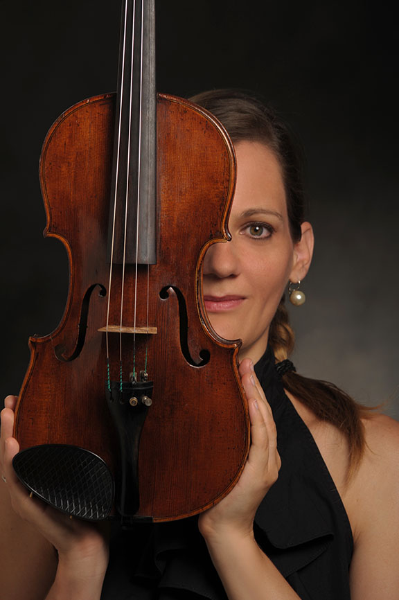 Orsi Szalados Orsi's close portrait with her violin covering half of her face