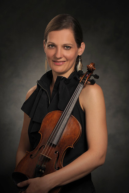 Orsi Szalados Orsi holding her violin.