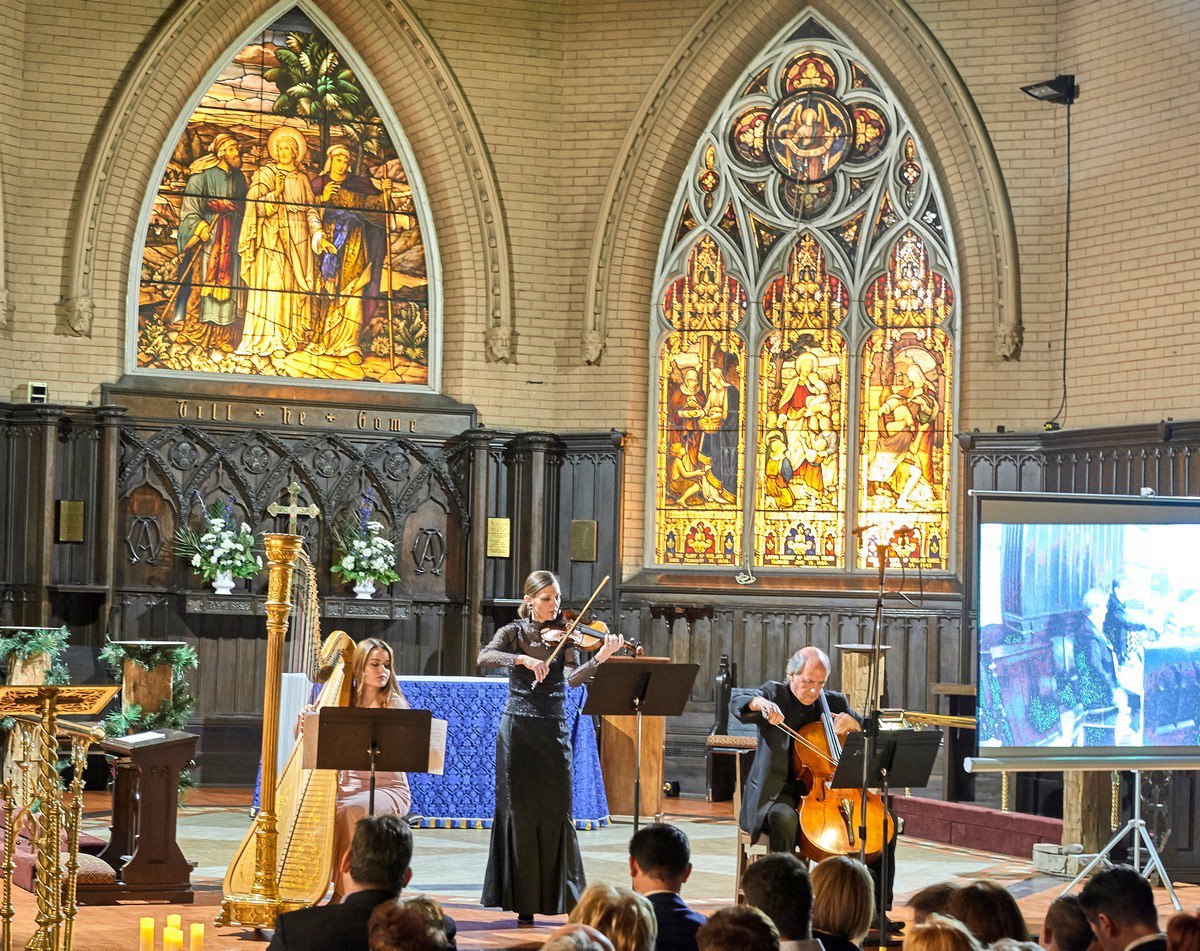 Performance in church with harp, violin, and cello 2